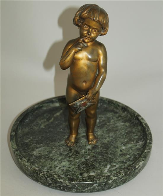 An early 20th century patinated bronze of a small child standing holding a letter, 9ins wide